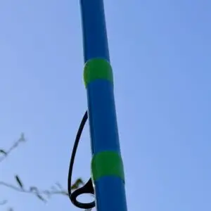 Over the Bar 13' Blue fishing rod with green wraps and grips